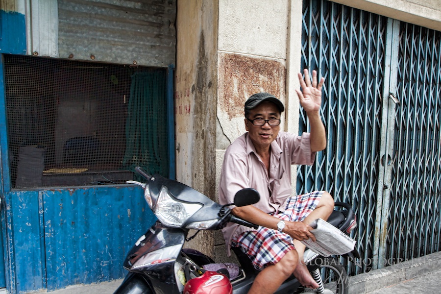 A friendly hello as we drove past! I loved that the guy sits on his motorbike to read his morning paper! A friendly hello as we drove past! I loved that the guy sits on his motorbike to read his morning paper!