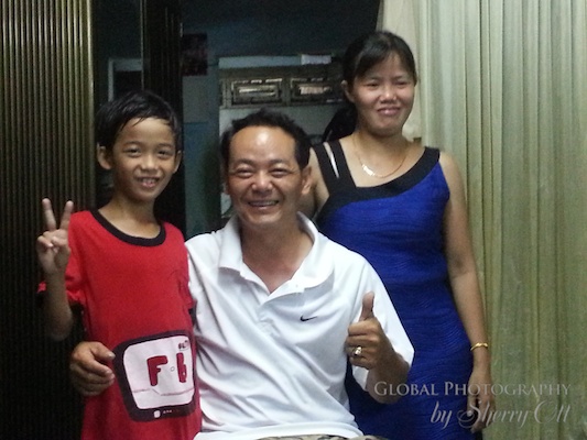 Lam’s wife (and wonderful cook) and youngest son. Lam’s wife (and wonderful cook) and youngest son.